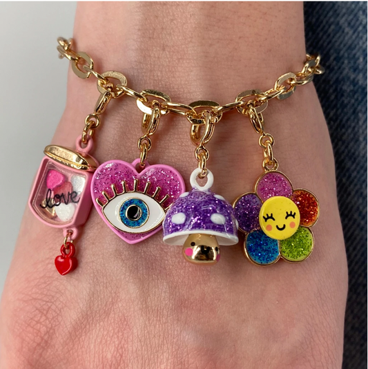 Charm It! Goldfarbener Shaker-Anhänger „Herzen im Glas“